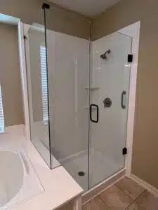 frameless shower glass door with panel and return in Dallas TX with a starting prices of $1500. Call Elite Showers 469-484-7321